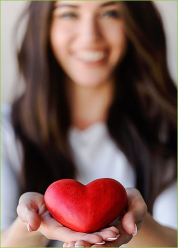 Woman holding red heart