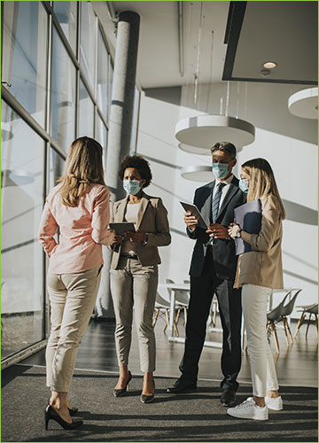 Co-workers With Masks at Work